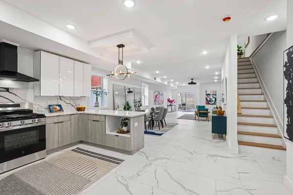 a kitchen with cabinets and window