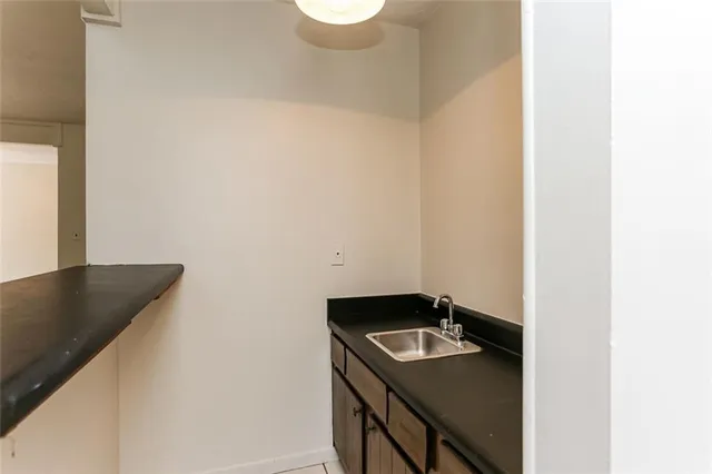 a view of utility room with sink washer and dryer