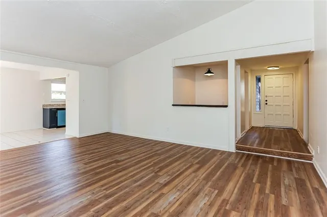 a view of an empty room and glass door