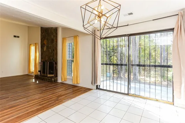 a view of a room with wooden floor