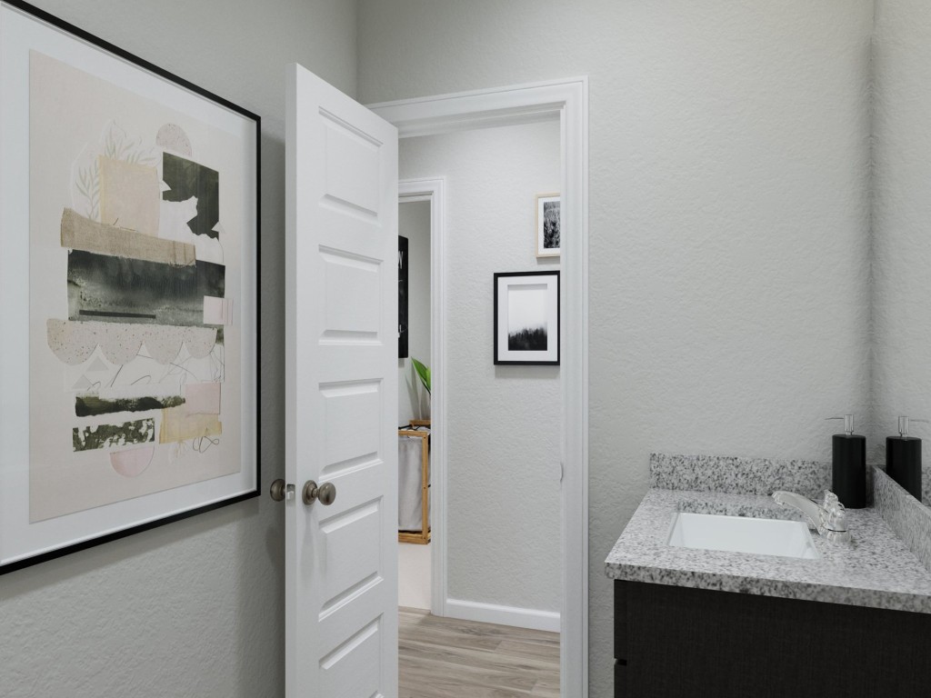 2312 Pipefish Drive Conroe, TX 77384 - Photo 28 of 33 a bathroom with a granite countertop sink a mirror and shower