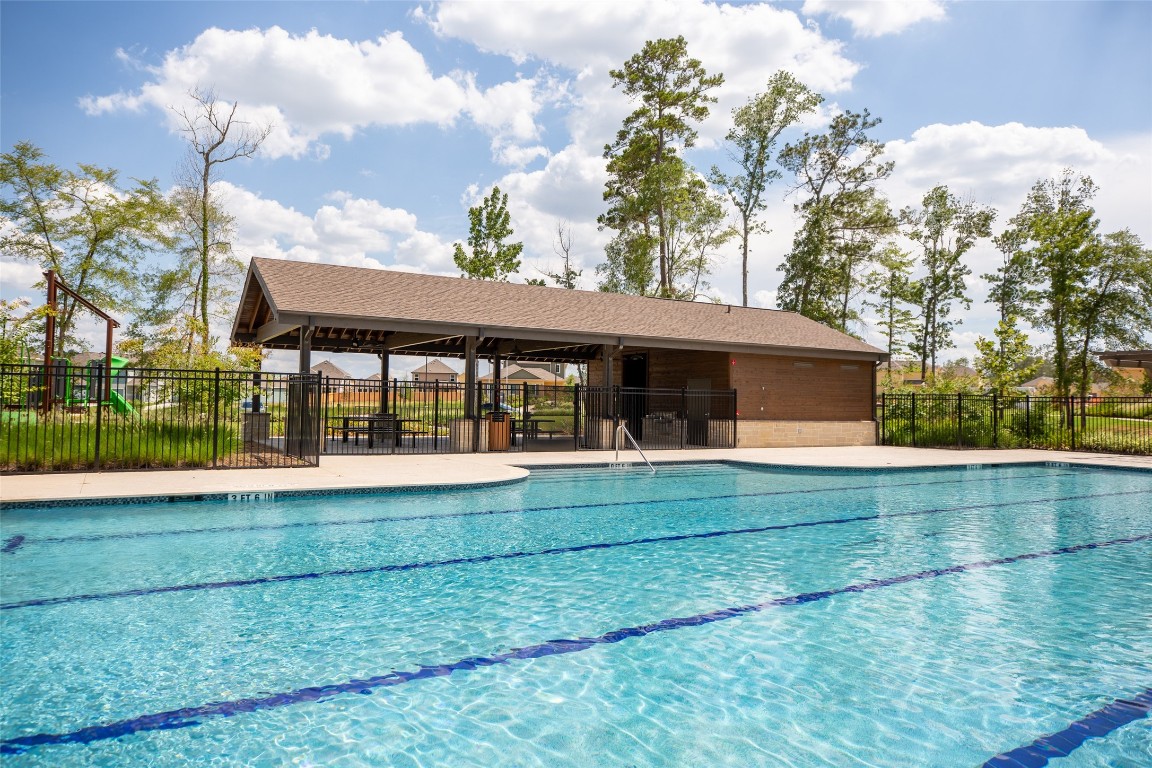 2312 Pipefish Drive Conroe, TX 77384 - Photo 12 of 33 a front view of a house with garden