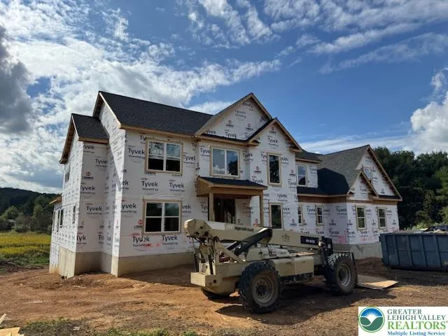 a view of a house with furniture and a fire pit