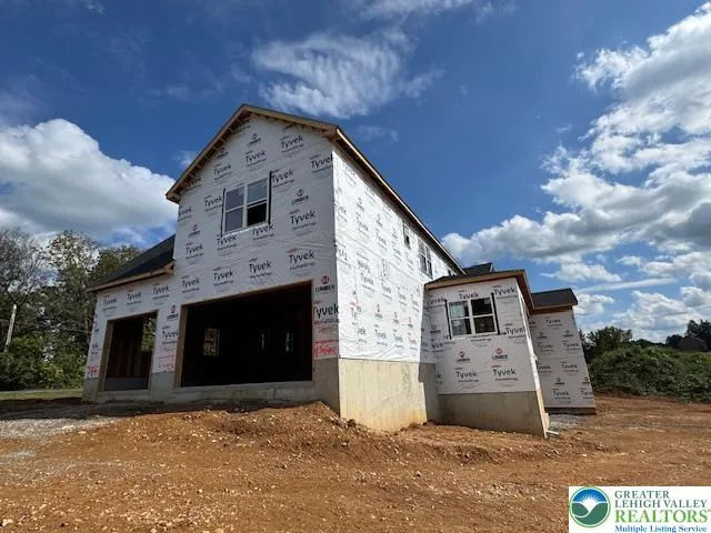 a front view of a house with a garage