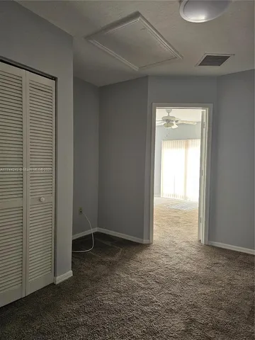 a view of an empty room and window