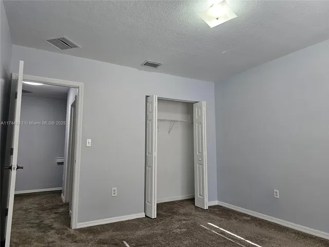 an empty room with closet