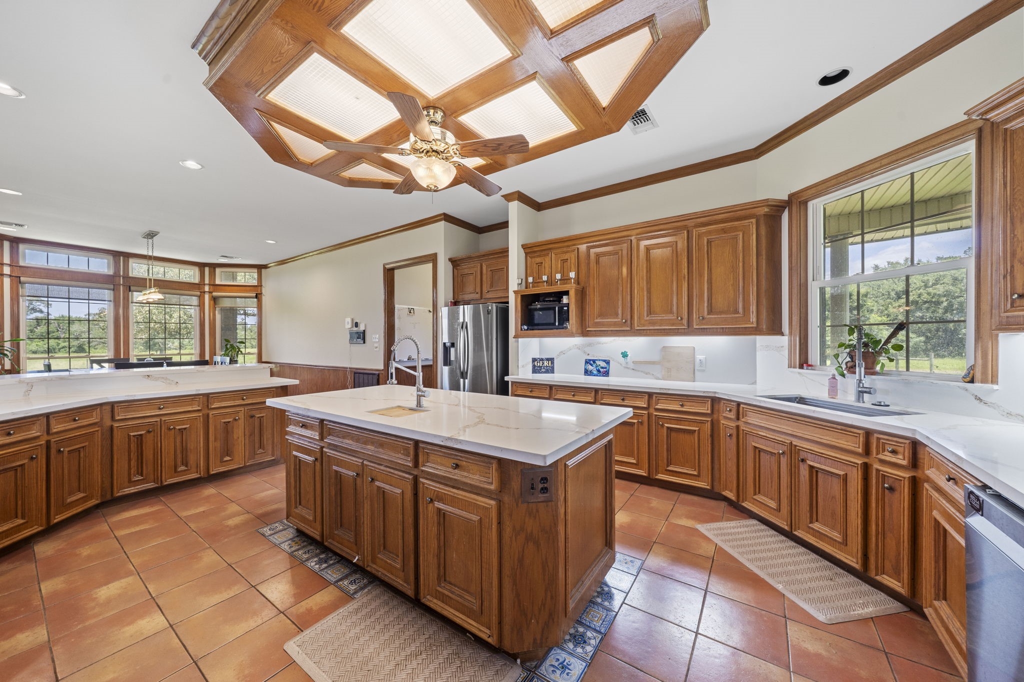 35111 Tompkins Road Hempstead, TX 77445 - Photo 14 of 50 a kitchen with stainless steel appliances granite countertop a stove a sink dishwasher and a refrigerator