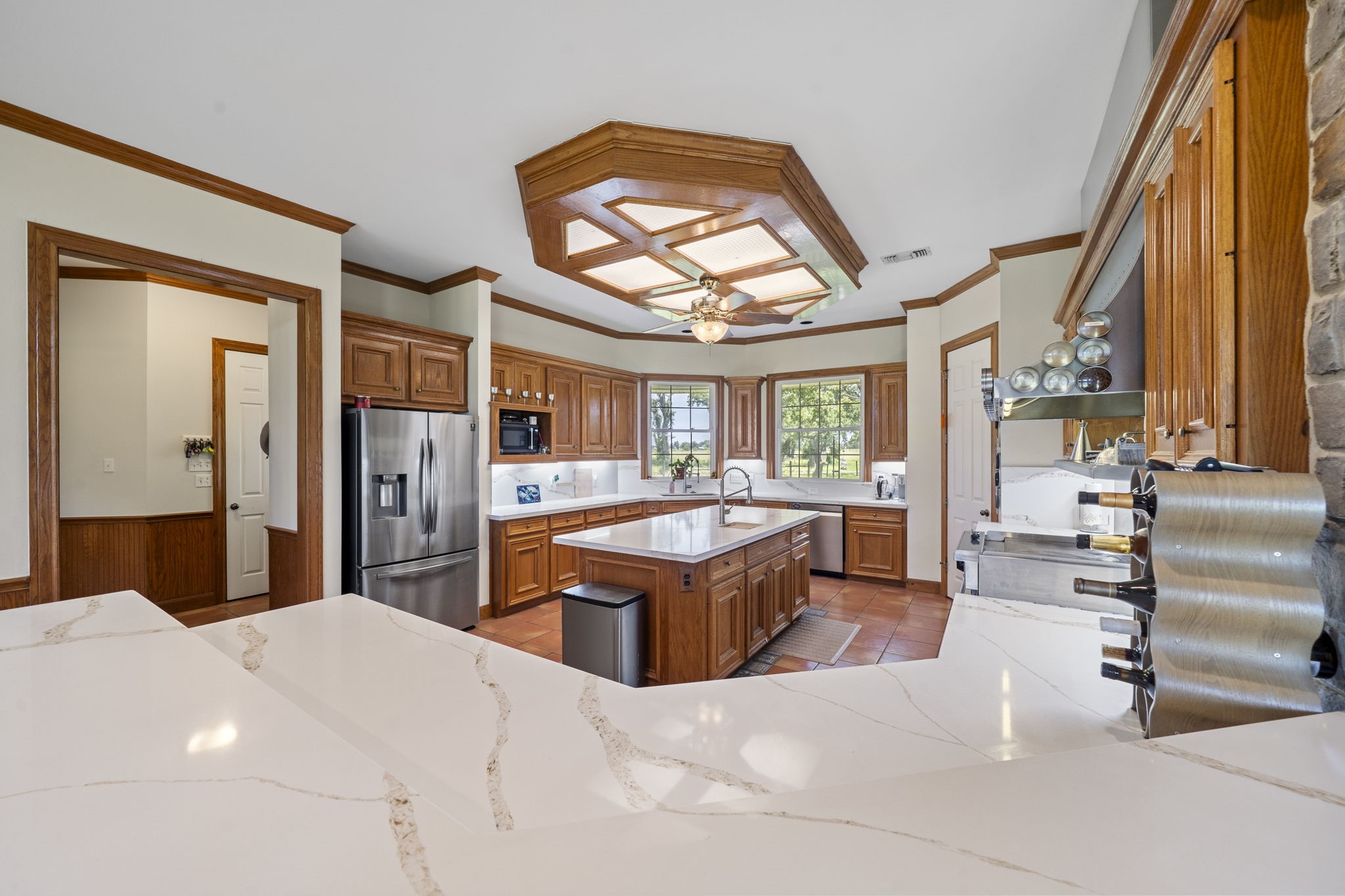 35111 Tompkins Road Hempstead, TX 77445 - Photo 15 of 50 a kitchen with stainless steel appliances kitchen island granite countertop a refrigerator and a sink