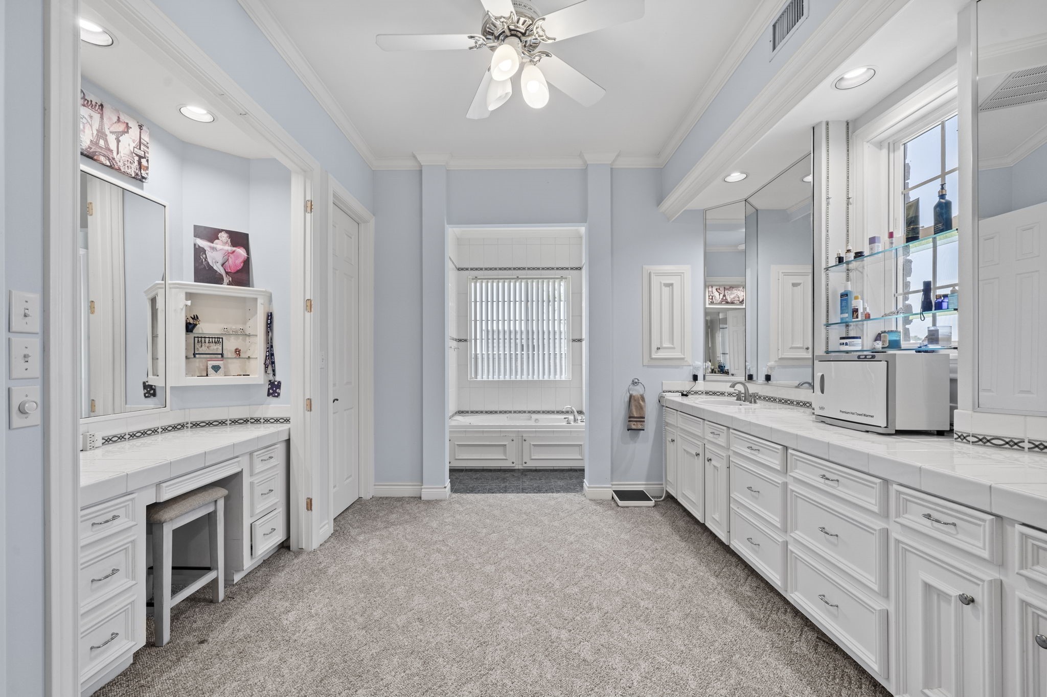 35111 Tompkins Road Hempstead, TX 77445 - Photo 19 of 50 a spacious bathroom with a granite countertop sink mirror and a bathtub