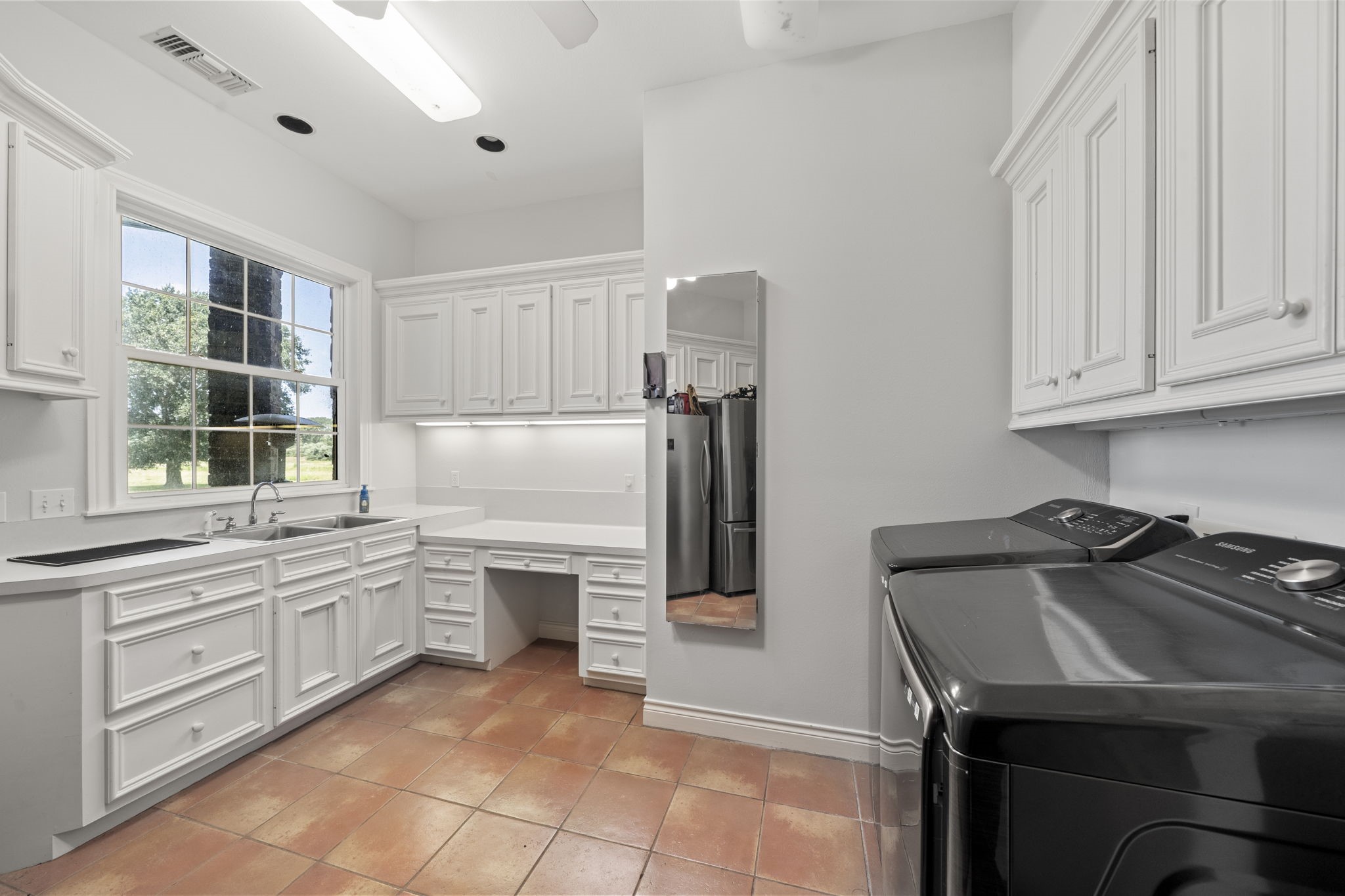 35111 Tompkins Road Hempstead, TX 77445 - Photo 28 of 50 a kitchen with a sink appliances and cabinets
