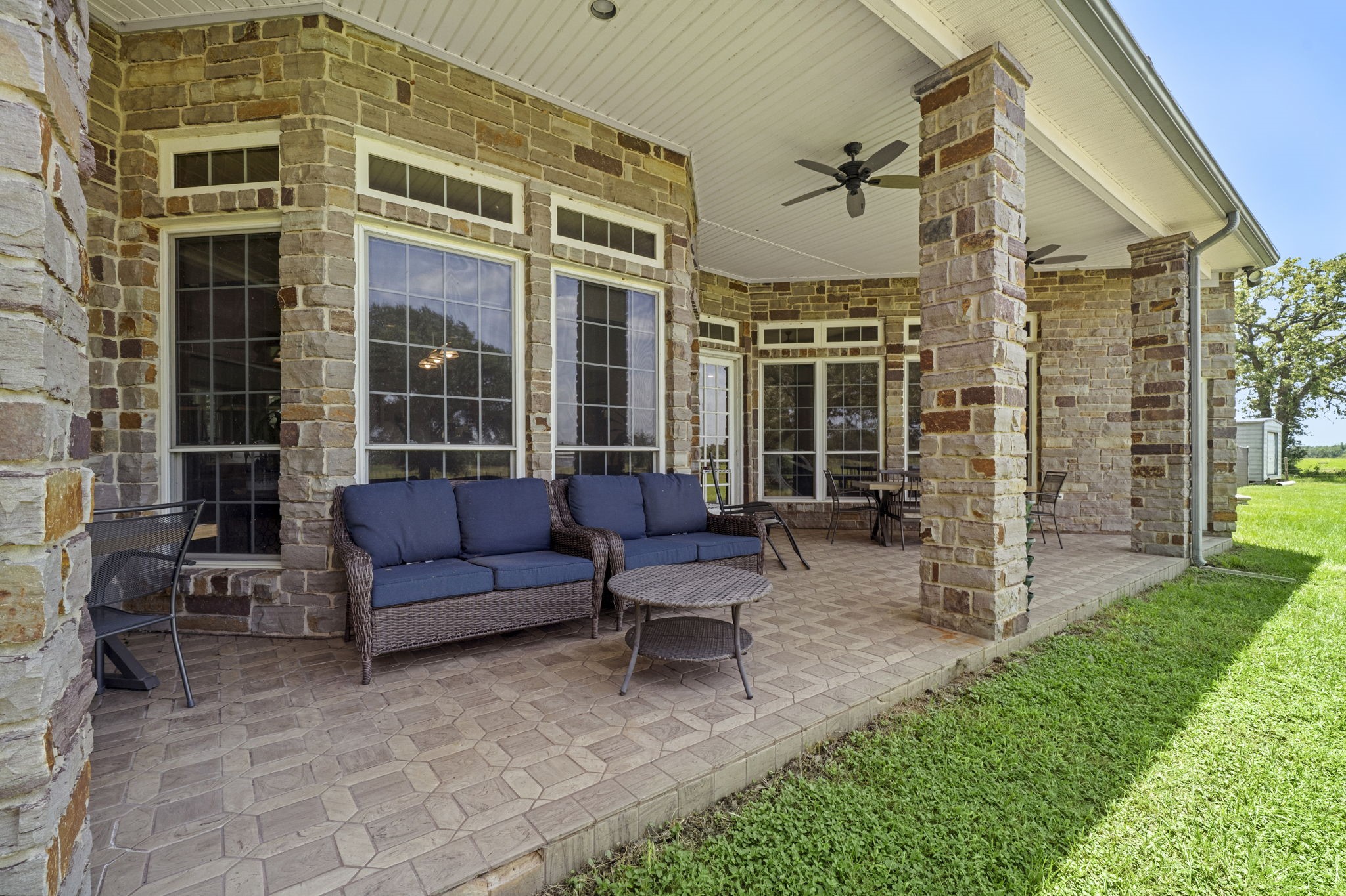 35111 Tompkins Road Hempstead, TX 77445 - Photo 35 of 50 a view of a patio with couches table and chairs and potted plants