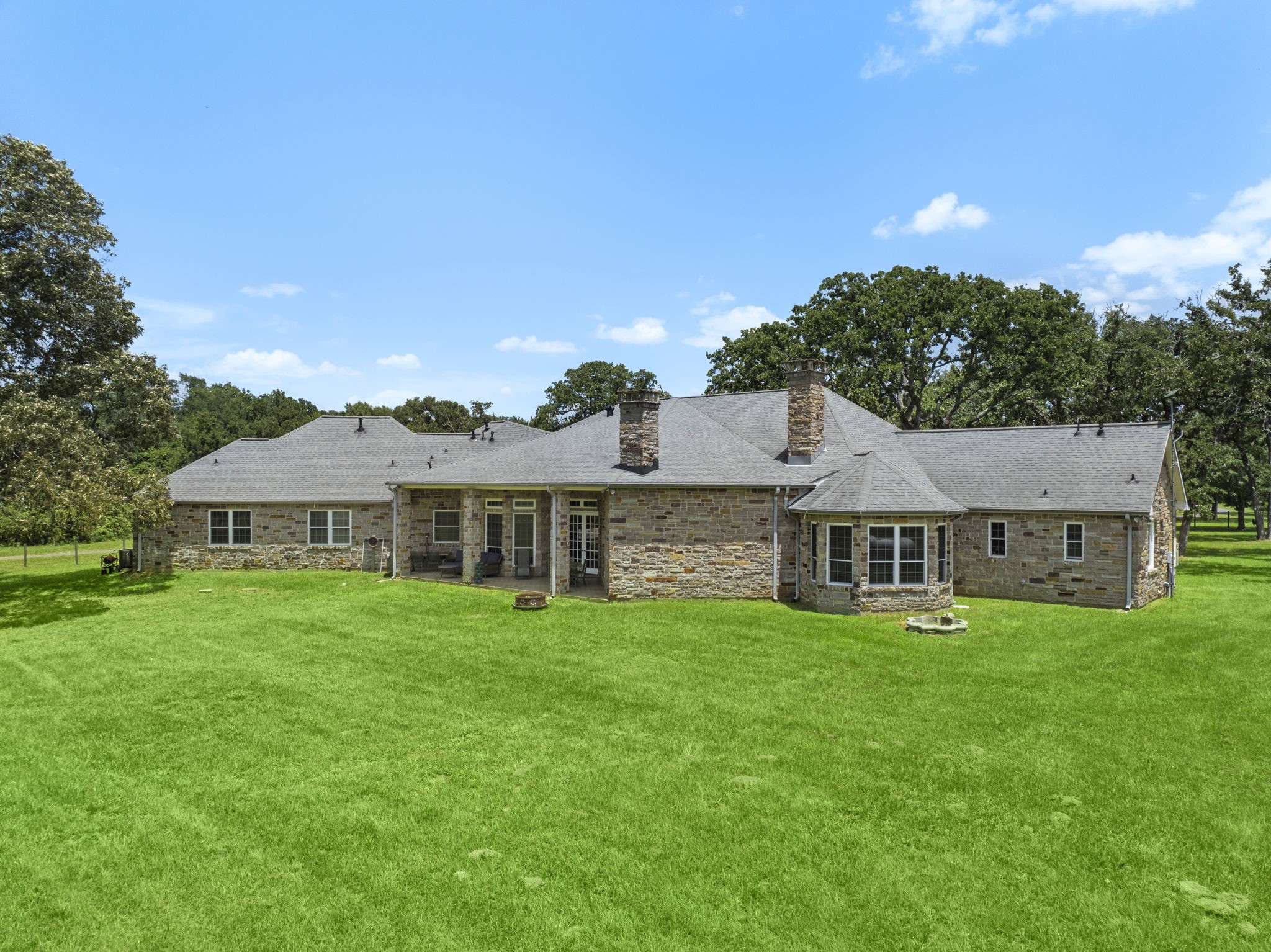 35111 Tompkins Road Hempstead, TX 77445 - Photo 46 of 50 a view of a house with a big yard and large trees
