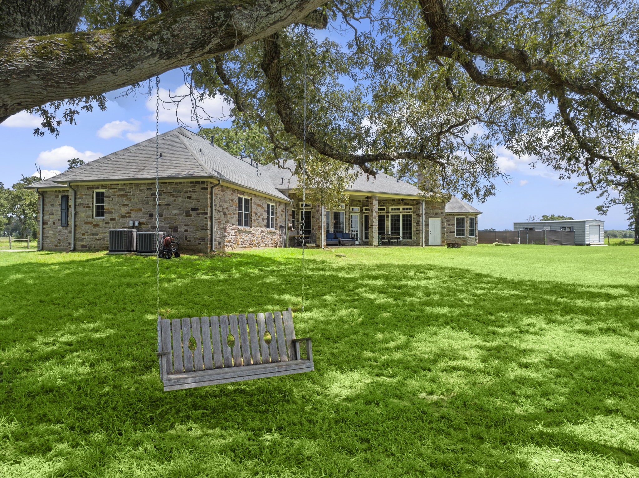 35111 Tompkins Road Hempstead, TX 77445 - Photo 47 of 50 a view of a house with a yard deck and a large tree