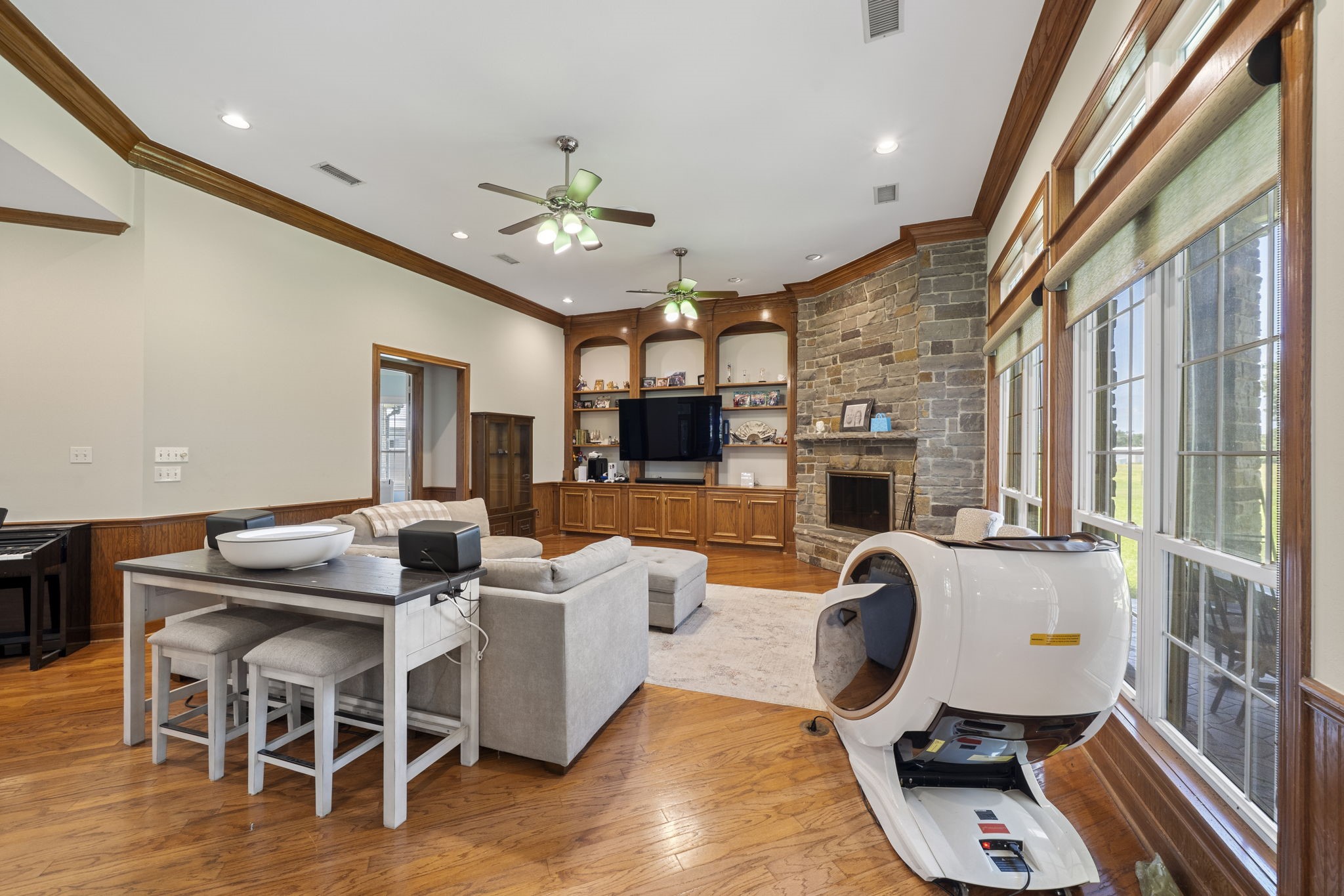 35111 Tompkins Road Hempstead, TX 77445 - Photo 9 of 50 a living room with furniture a fireplace and a flat screen tv