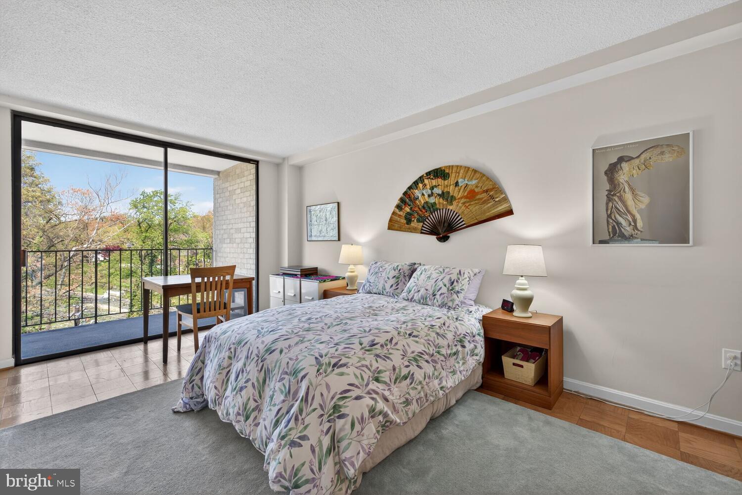 2100 Washington Avenue, Unit 6A Silver Spring, MD 20910 - Photo 6 of 16 a bedroom with a bed and a large window