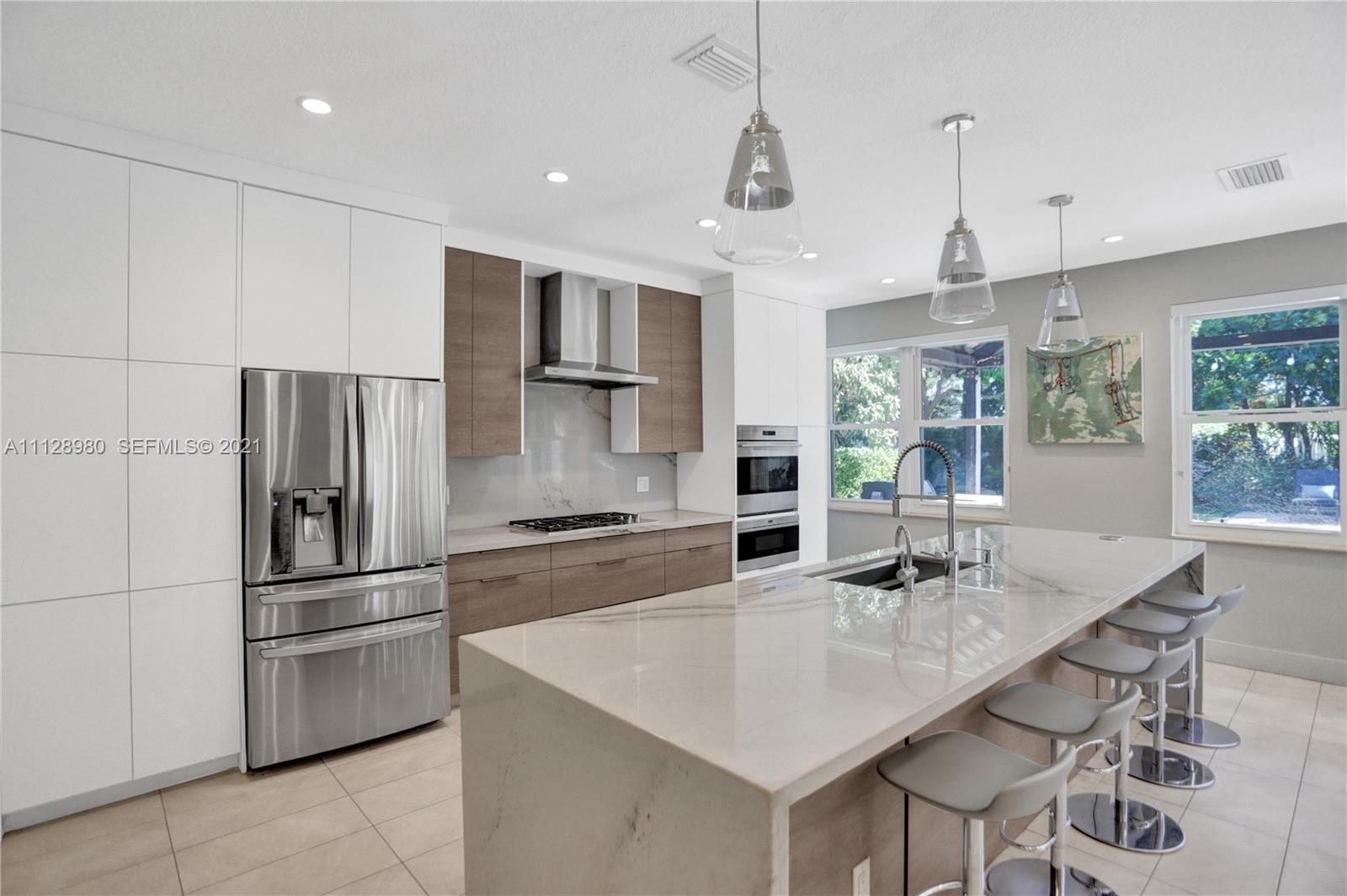 1078 Briar Ridge Road Weston, FL 33327 - Photo 16 of 41 a kitchen with granite countertop a sink stainless steel appliances and counter space