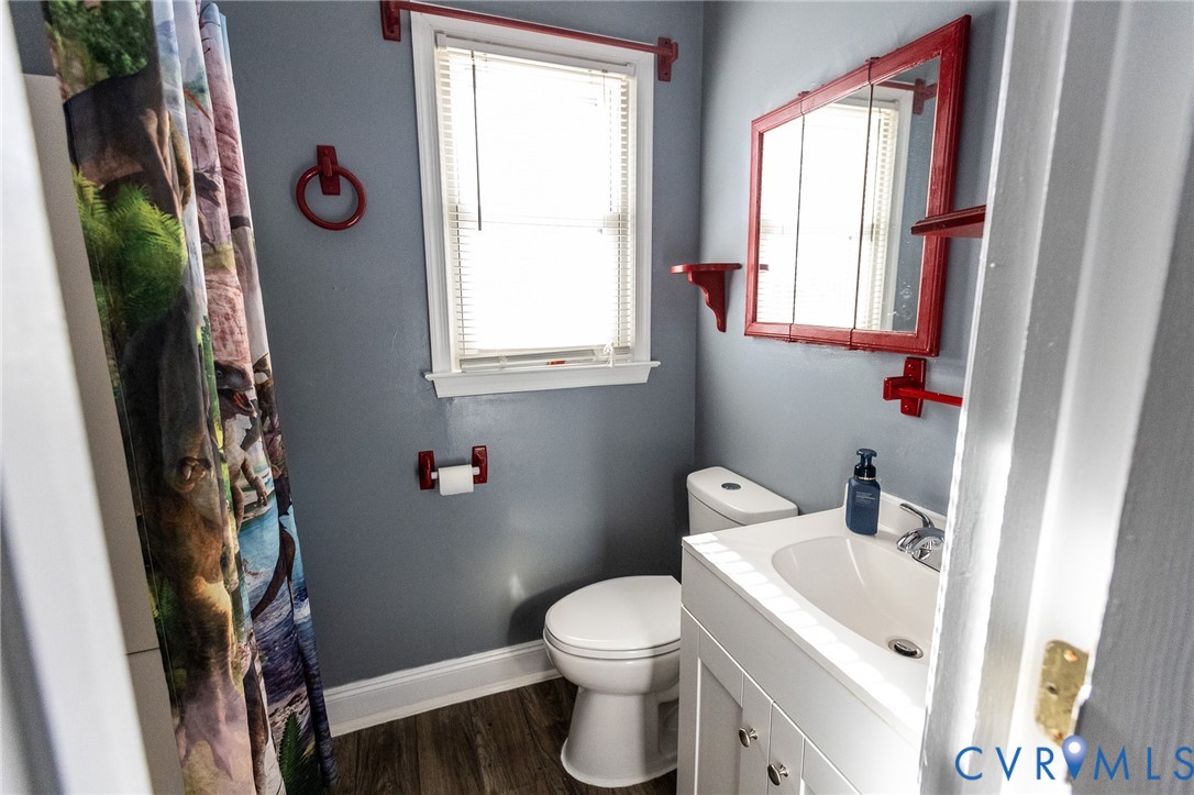 3213 Drawbridge Court Chesapeake, VA 23323 - Photo 11 of 20 a bathroom with a toilet a sink and a mirror