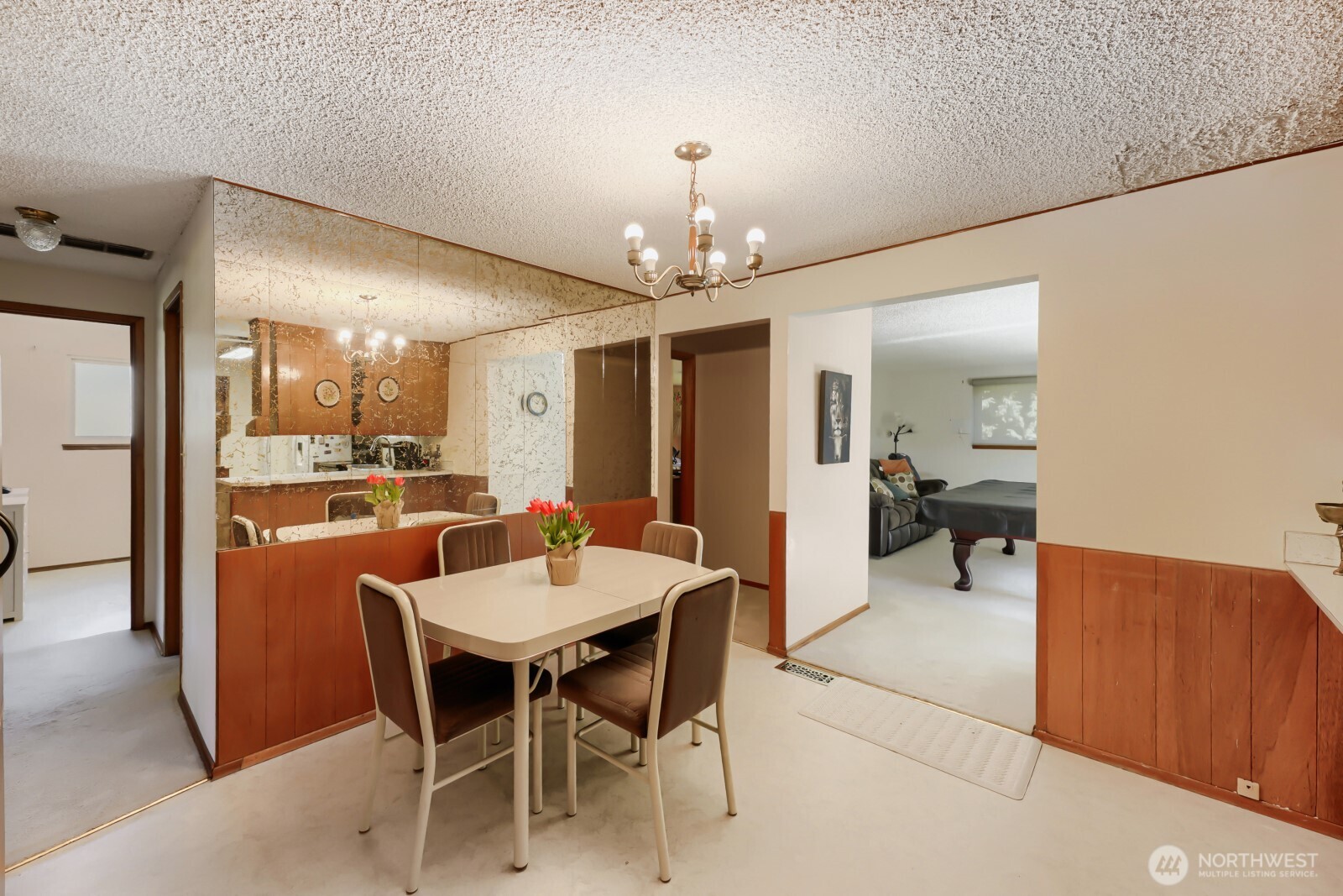 24119 78th Place West Edmonds, WA 98026 - Photo 11 of 29 a view of a dining room with furniture and a chandelier