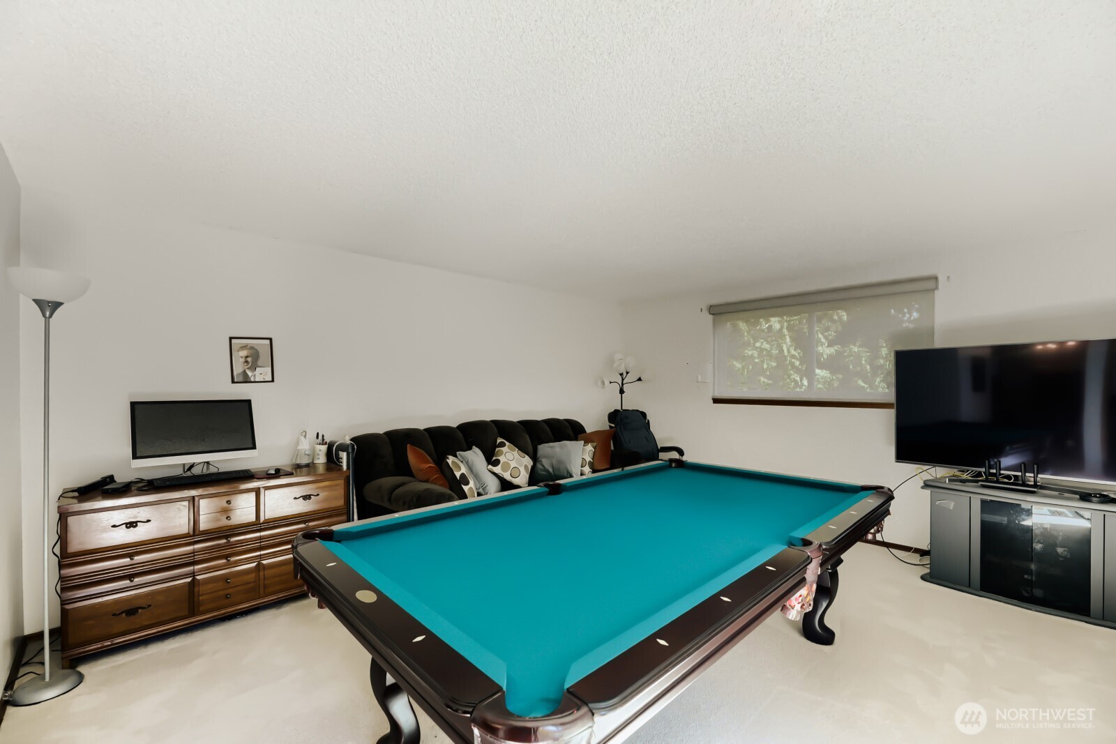 24119 78th Place West Edmonds, WA 98026 - Photo 16 of 29 a room with furniture and a flat screen tv