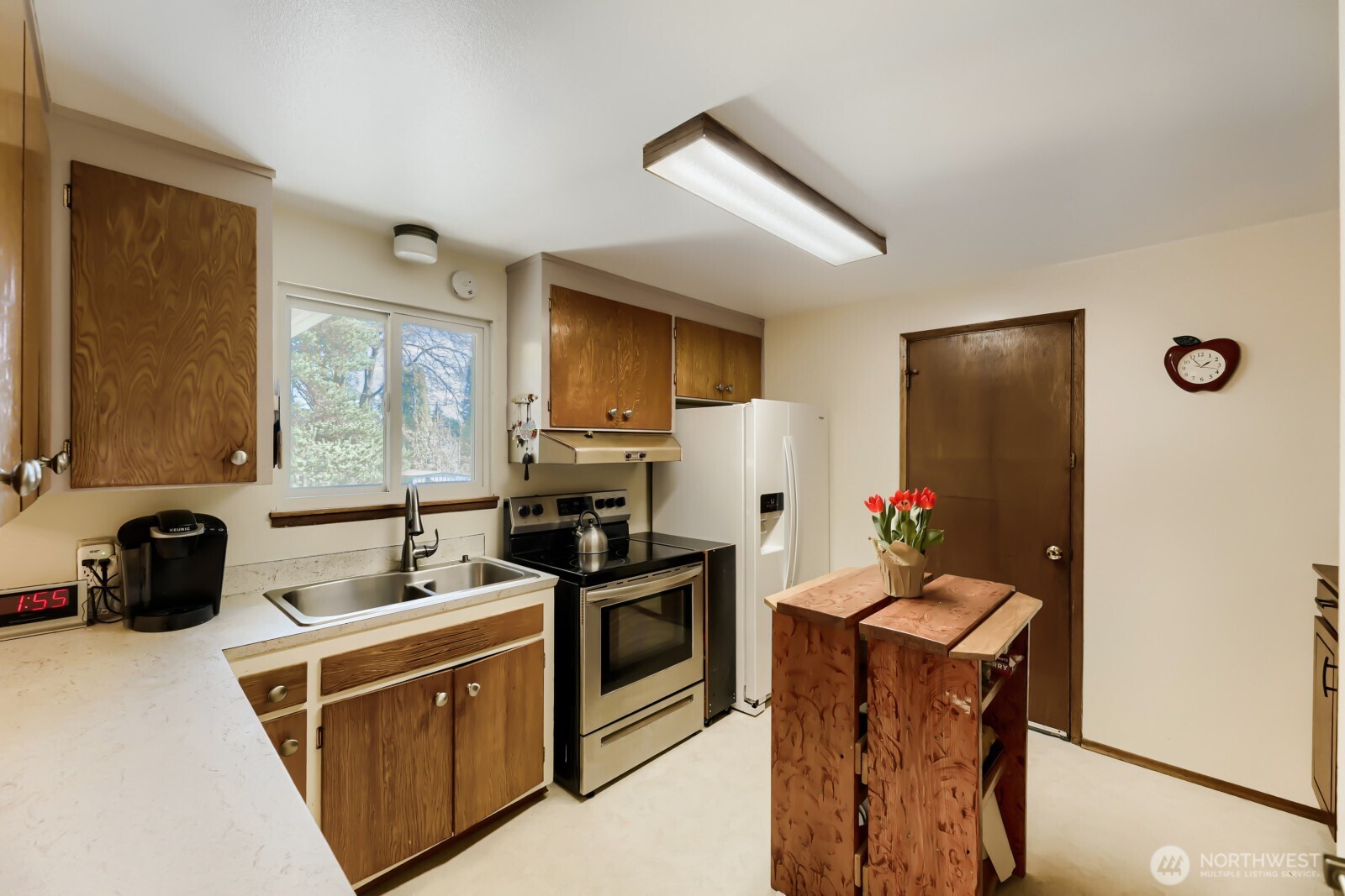 24119 78th Place West Edmonds, WA 98026 - Photo 8 of 29 a kitchen with stainless steel appliances a sink stove and refrigerator