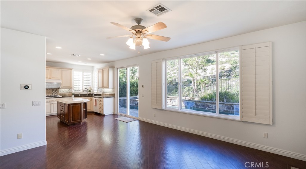2827 Arbella Lane Thousand Oaks, CA 91362 - Photo 12 of 48 a view of a large kitchen with wooden floor and a window