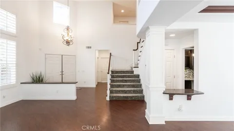 a view of staircase with white walls and windows