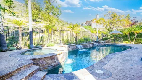 a view of a swimming pool with a patio
