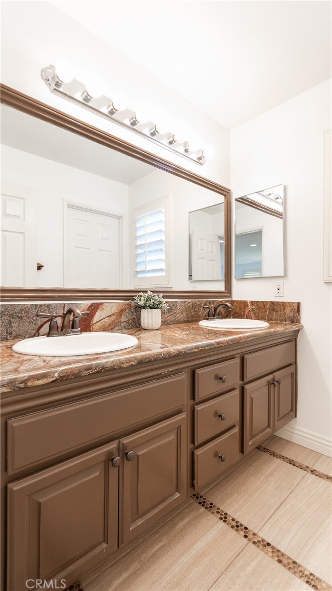 2827 Arbella Lane Thousand Oaks, CA 91362 - Photo 32 of 48 a bathroom with a sink and a mirror
