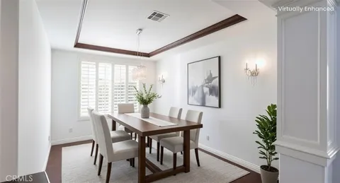 a view of a dining room with furniture and window