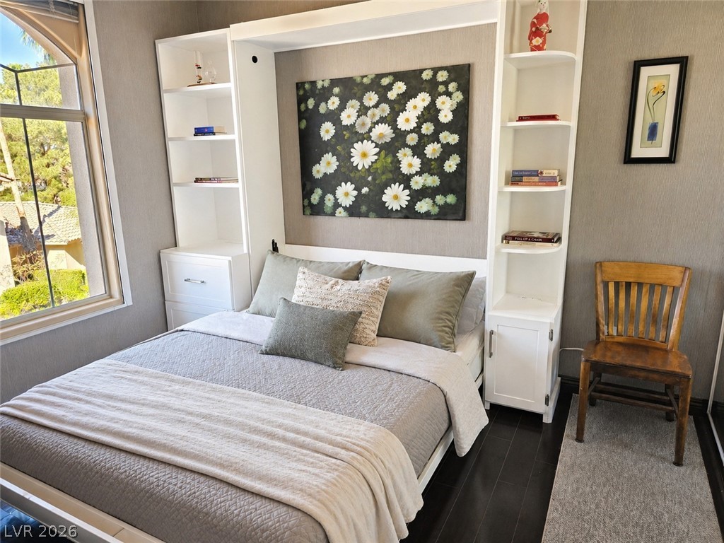 2050 West Warm Springs Road, Unit 2422 Henderson, NV 89014 - Photo 31 of 44 This cozy bedroom features a clever built-in wall unit and ample natural light.
