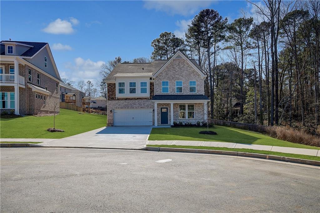 309 Exeter Court Stockbridge, GA 30281 - Photo 1 of 34 a front view of house with yard and green space