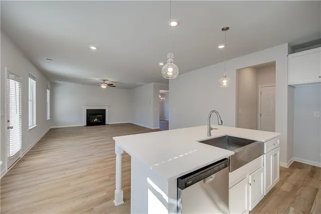 a kitchen with a stove a sink and a refrigerator
