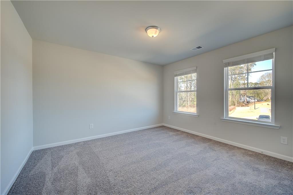 309 Exeter Court Stockbridge, GA 30281 - Photo 21 of 34 an empty room with a window