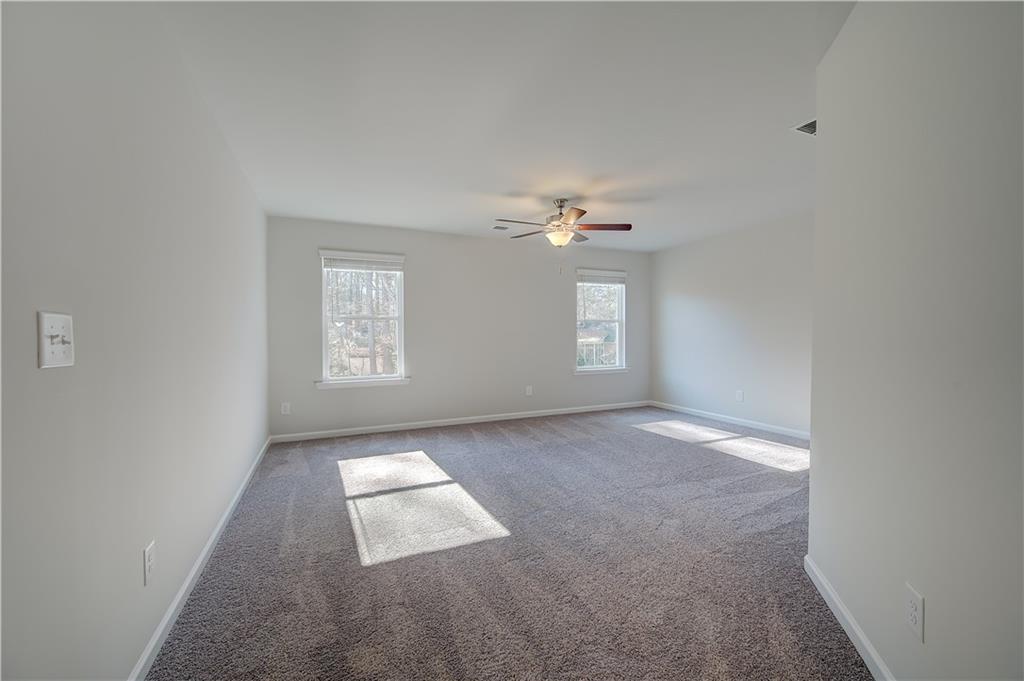 309 Exeter Court Stockbridge, GA 30281 - Photo 23 of 34 an empty room with windows