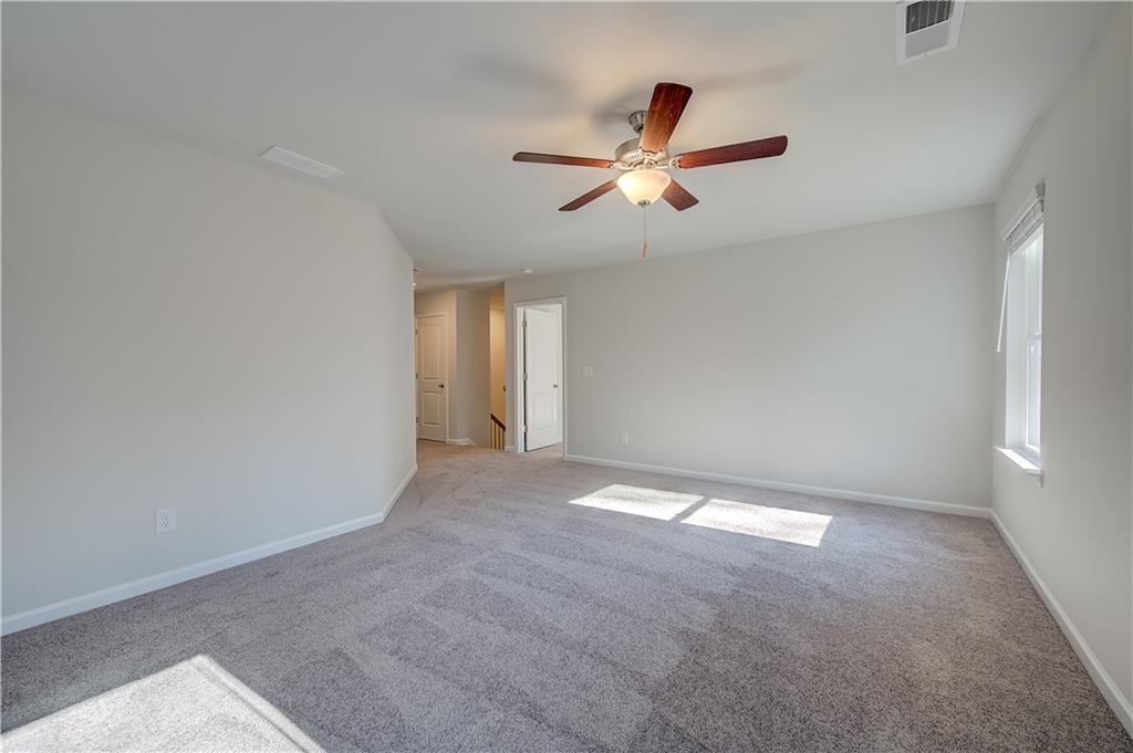 309 Exeter Court Stockbridge, GA 30281 - Photo 24 of 34 a view of an empty room with a window