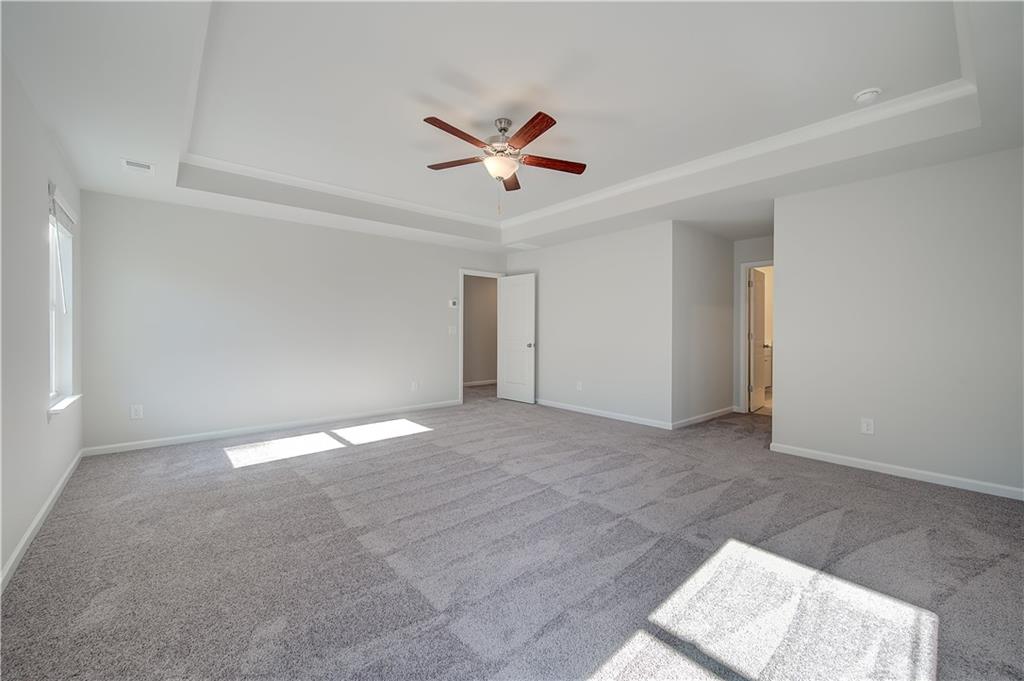 309 Exeter Court Stockbridge, GA 30281 - Photo 26 of 34 an empty room with closet and windows