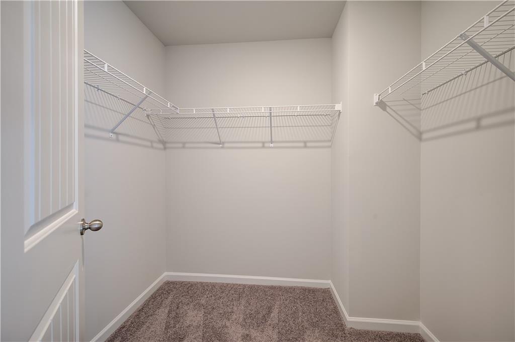 309 Exeter Court Stockbridge, GA 30281 - Photo 27 of 34 a view of a room with racks on the wall