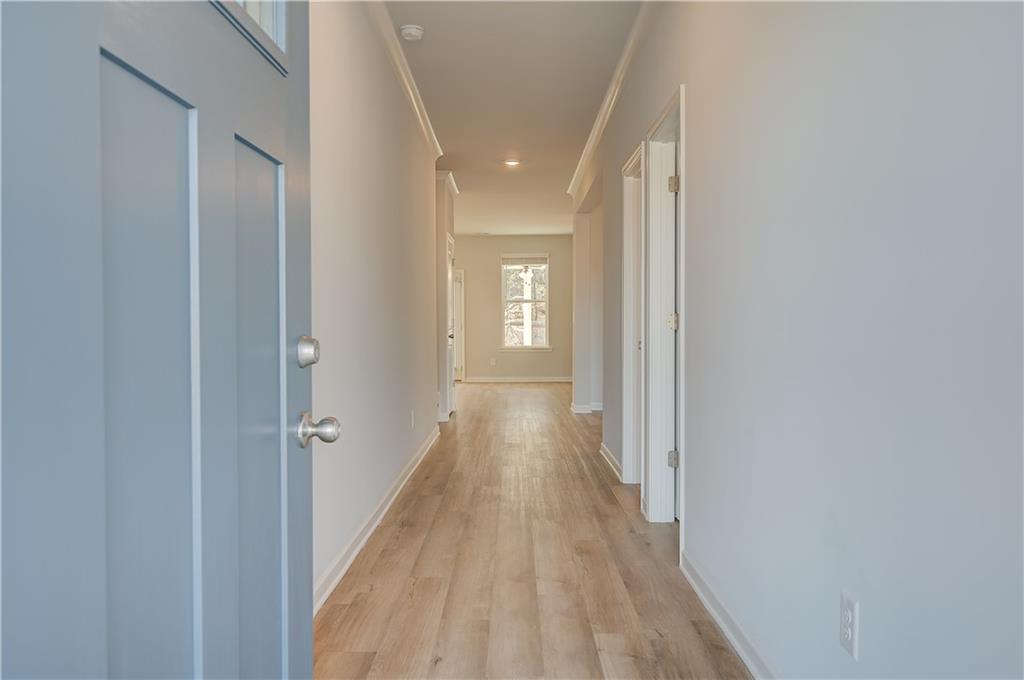 309 Exeter Court Stockbridge, GA 30281 - Photo 5 of 34 a view of a hallway with wooden floor