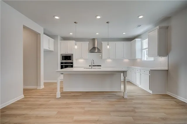 a view of kitchen with wooden floor