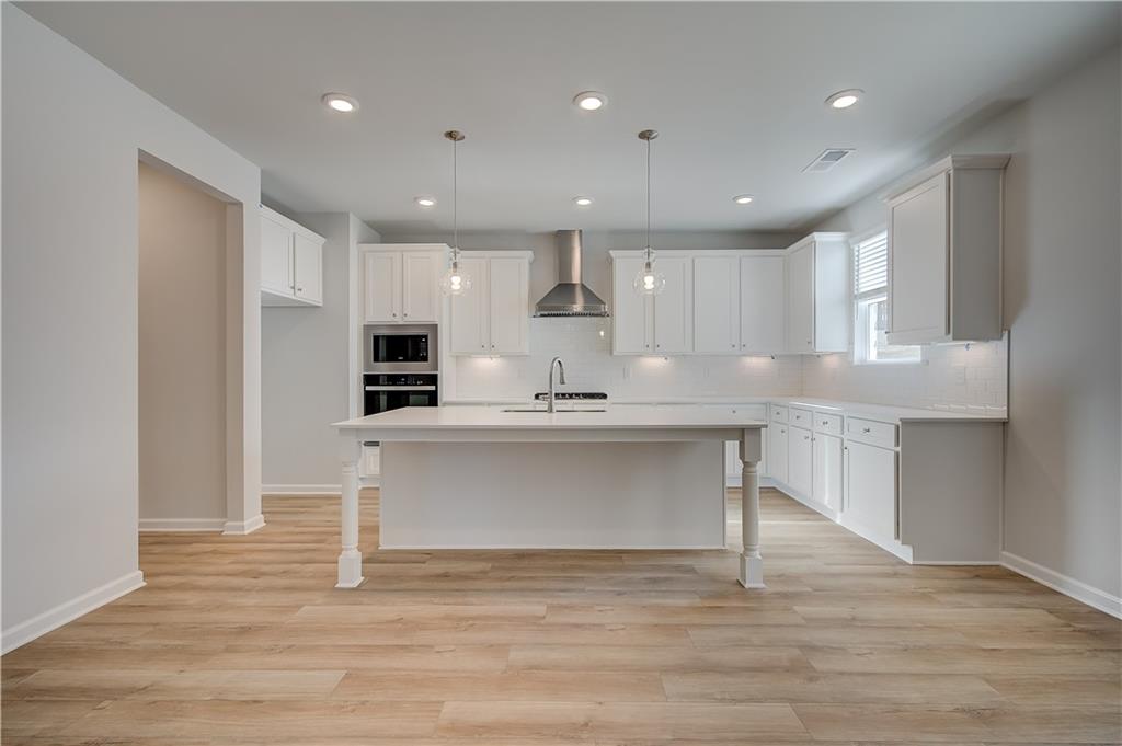 309 Exeter Court Stockbridge, GA 30281 - Photo 10 of 34 a view of kitchen with wooden floor