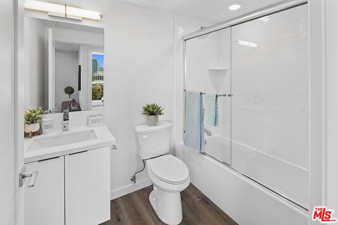 2783 Francis Avenue, Unit 307 Los Angeles, CA 90005 - Photo 9 of 9 a bathroom with a sink a toilet and shower