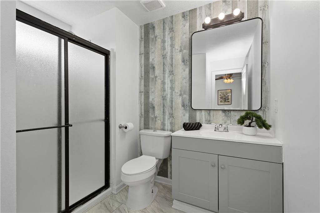 313 Hickory Nut Drive Eighty Four, PA 15330 - Photo 16 of 33 a bathroom with a toilet a sink and a mirror