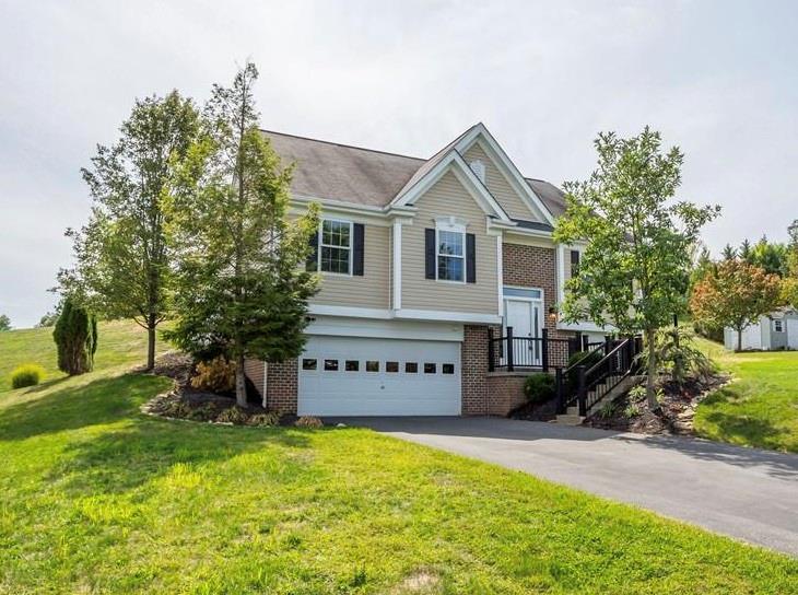 313 Hickory Nut Drive Eighty Four, PA 15330 - Photo 2 of 33 a front view of a house with a yard and potted plants