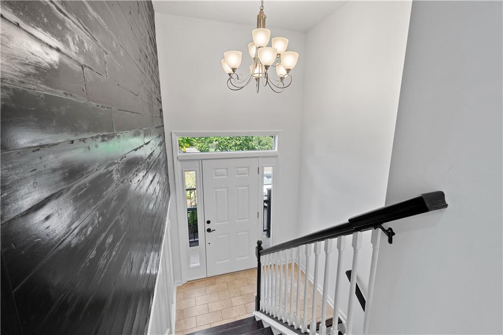 313 Hickory Nut Drive Eighty Four, PA 15330 - Photo 3 of 33 a view of a hallway with wooden floor and staircase