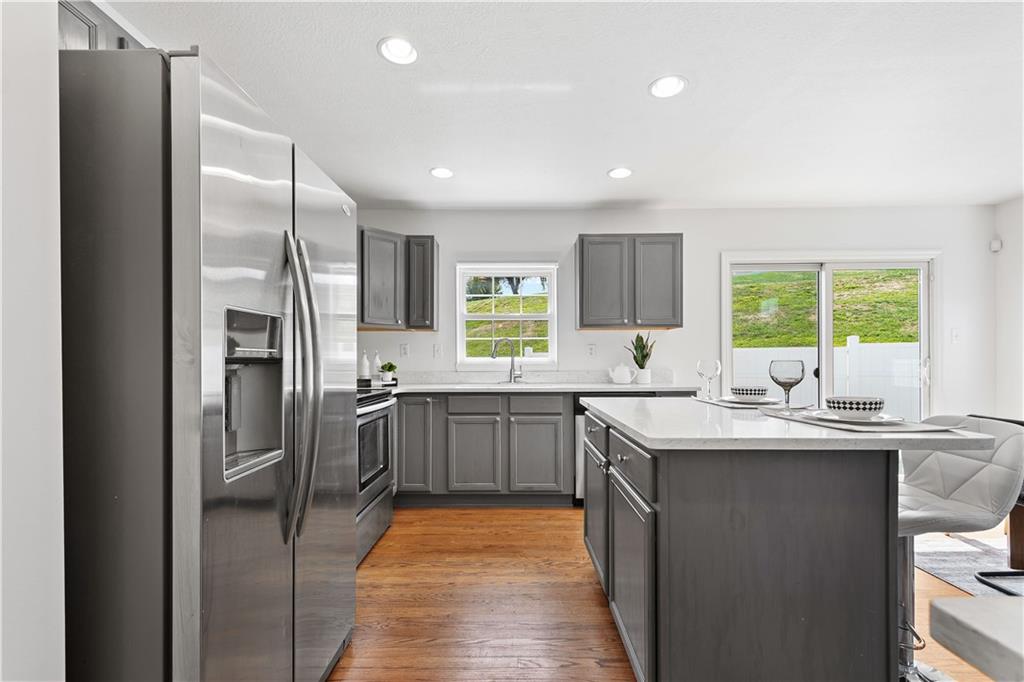313 Hickory Nut Drive Eighty Four, PA 15330 - Photo 10 of 33 a kitchen with stainless steel appliances granite countertop a sink stove and refrigerator