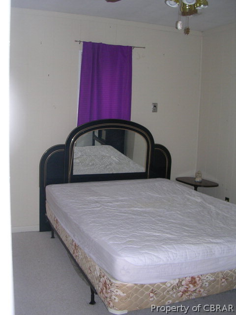 301 Beaumar Road Moon, VA 23119 - Photo 25 of 25 a bedroom with a bed and a dresser