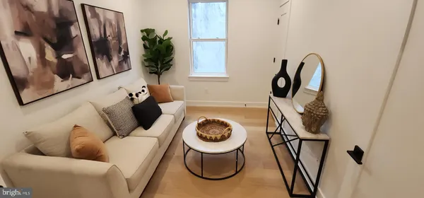 a bathroom with a toilet and a mirror