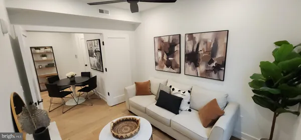 a view of living room with furniture and a window