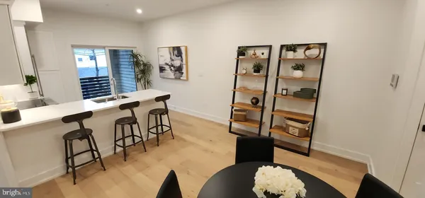 a view of entryway and livingroom with furniture
