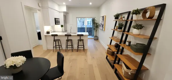 a living room with furniture floor and white walls